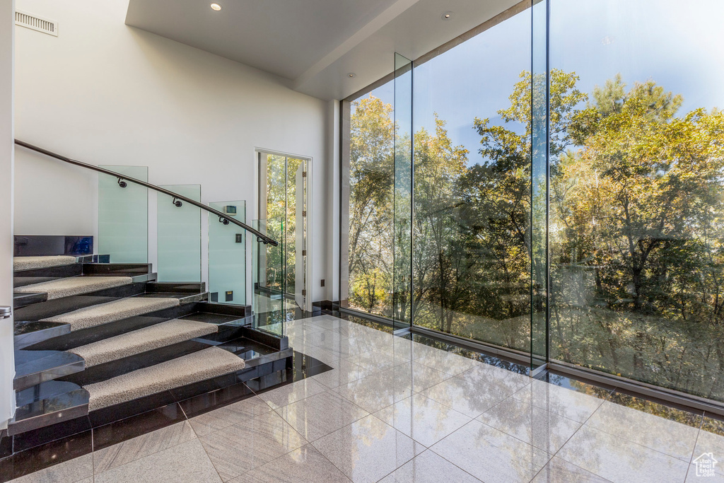 Staircase with expansive windows