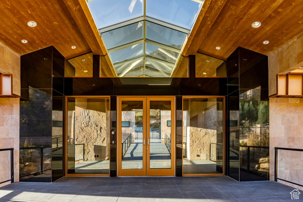 Property entrance featuring french doors