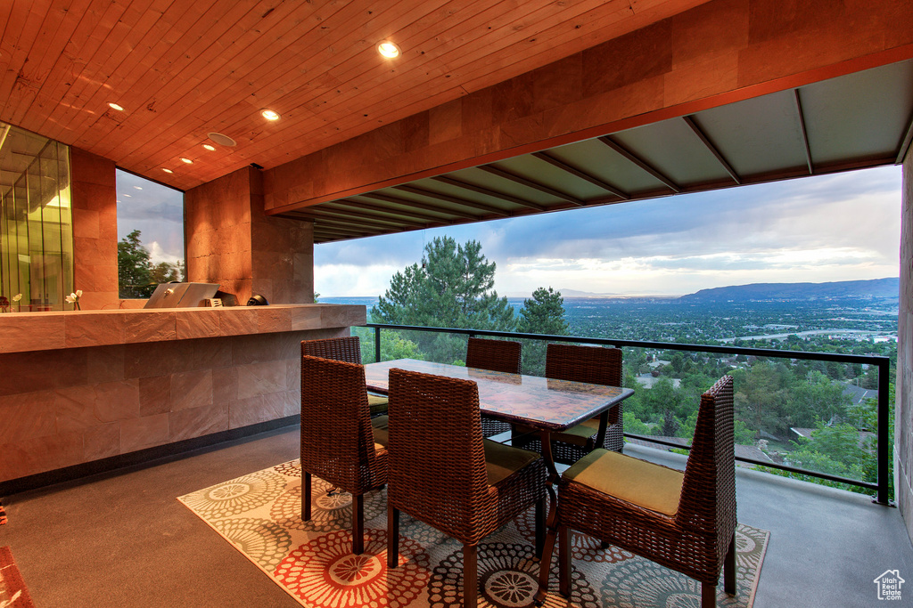 Exterior space with a balcony and a mountain view