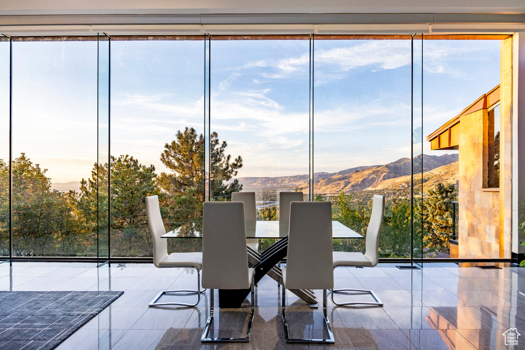 Sunroom with a mountain view