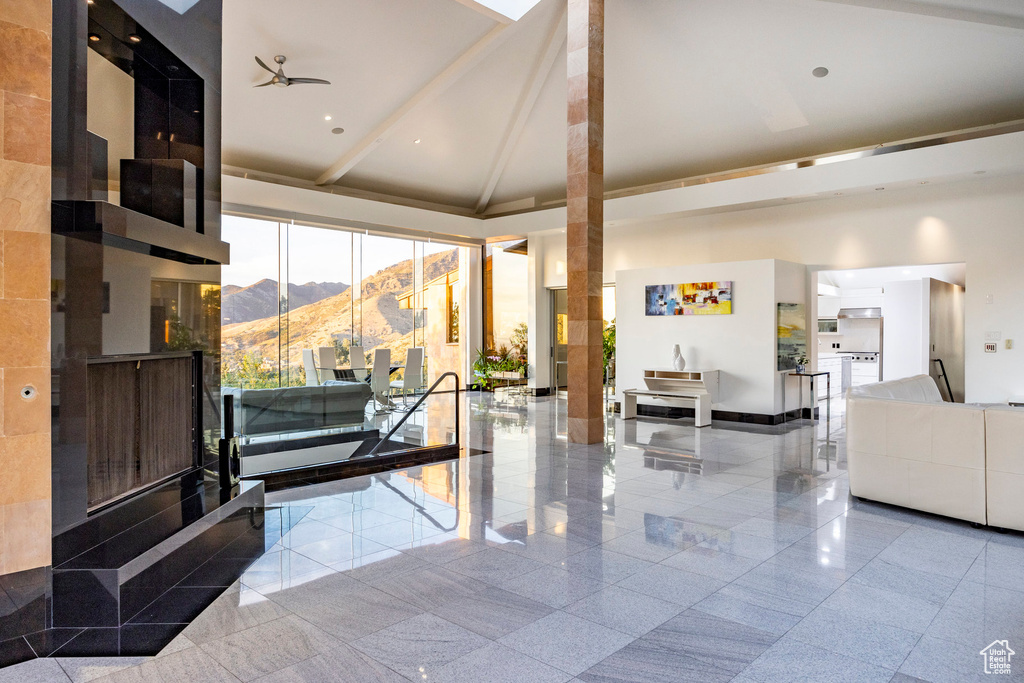 Lobby featuring a mountain view and a high ceiling