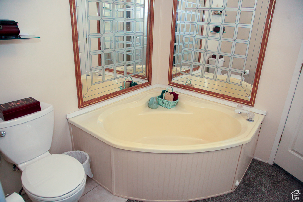 Bathroom with a tub and toilet