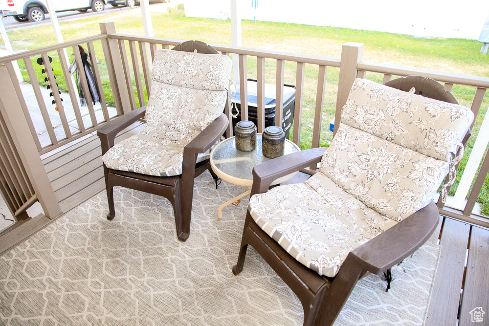 Wooden deck featuring a yard