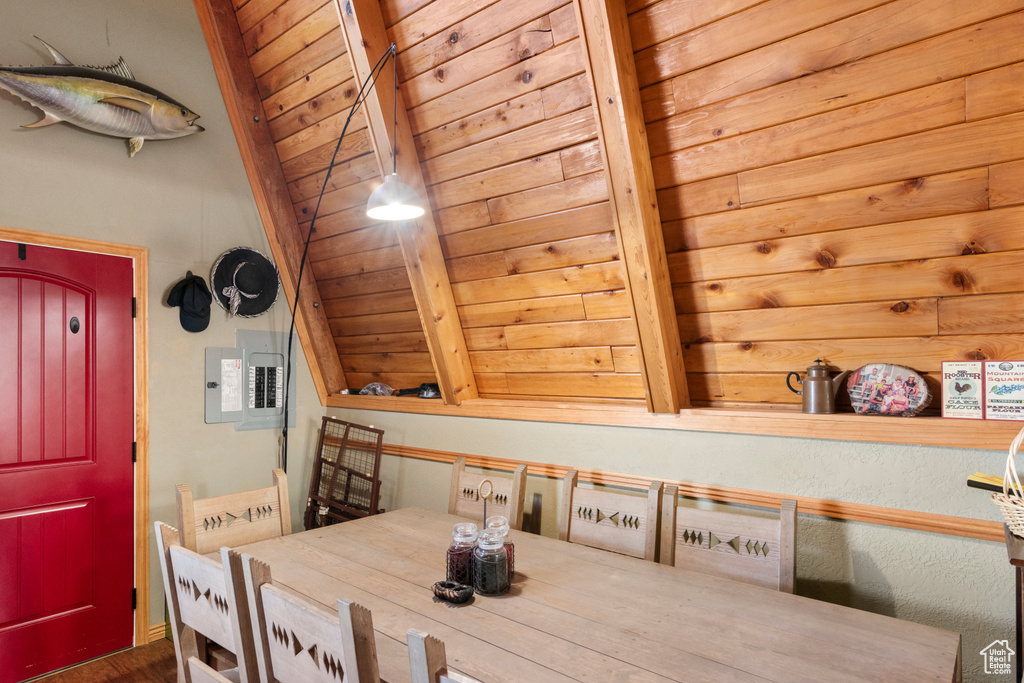 Dining space featuring wood ceiling and vaulted ceiling with beams