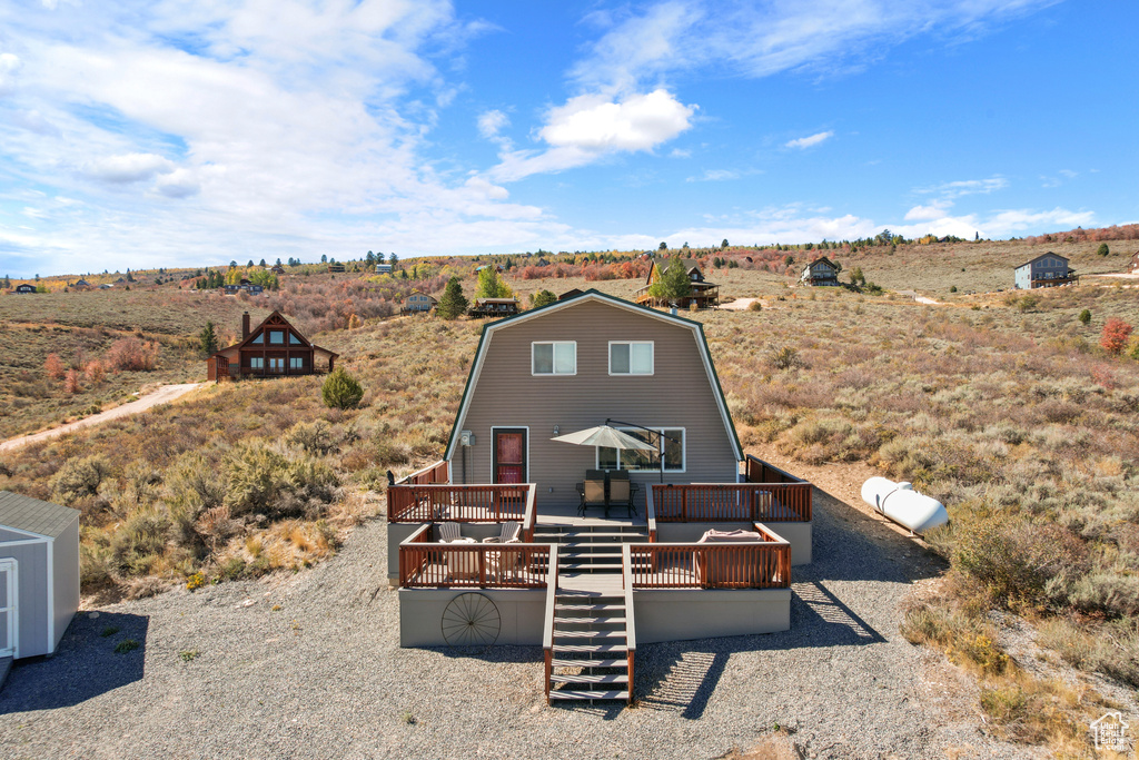 Exterior space featuring a rural view and a wooden deck