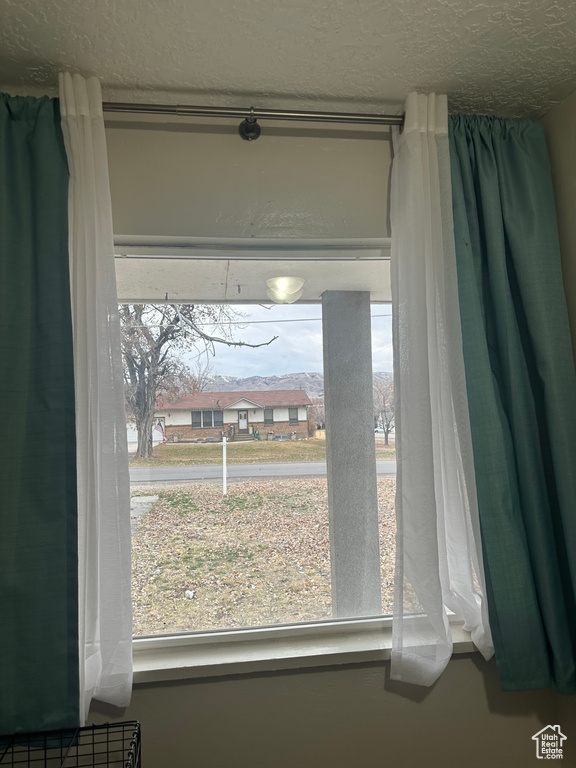 Room details featuring a textured ceiling