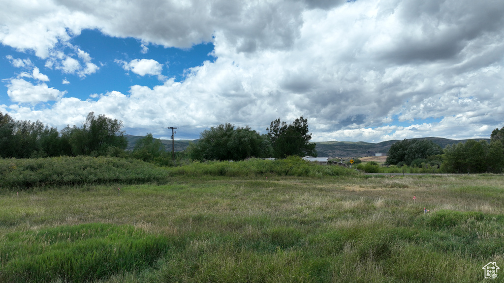 View of landscape featuring a mountain view and a rural view