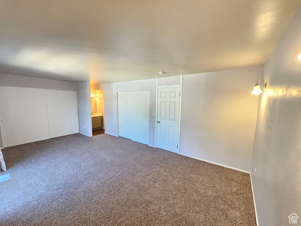 Interior space featuring dark carpet