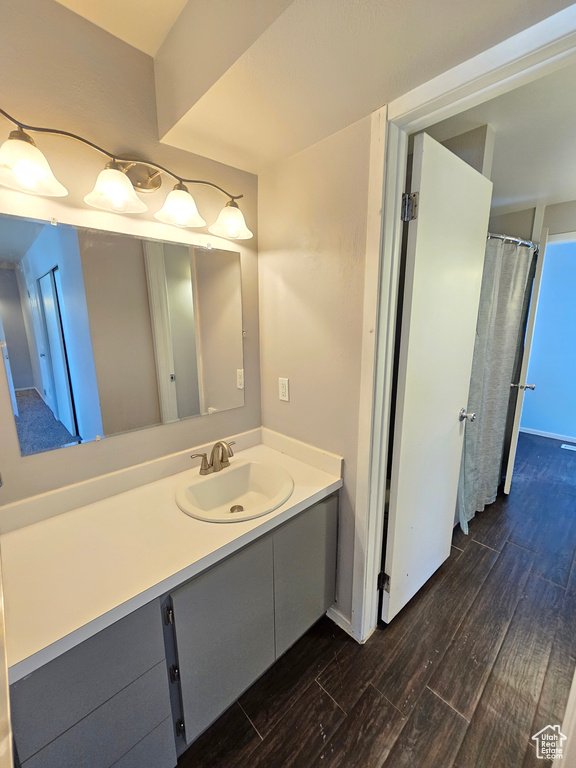 Bathroom featuring vanity and hardwood / wood-style flooring