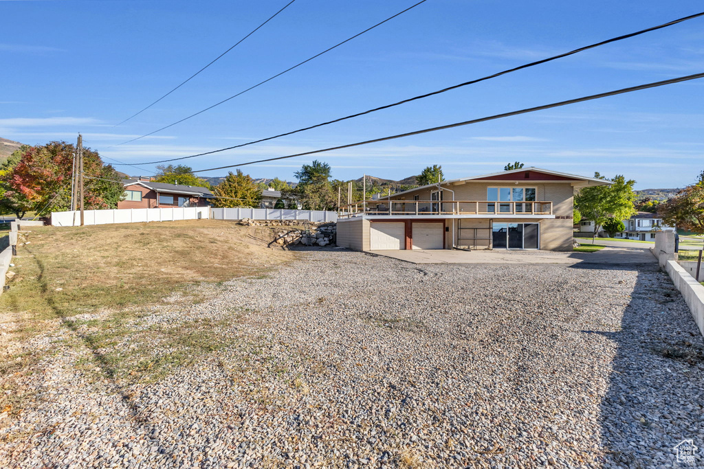 Rear view of house with a garage