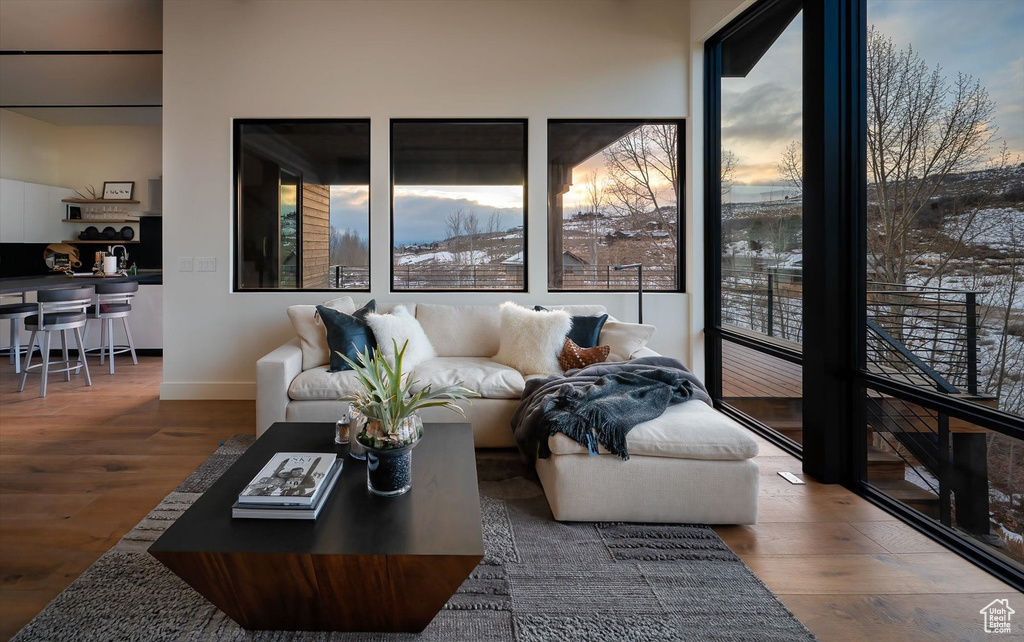 Living room with hardwood / wood-style flooring