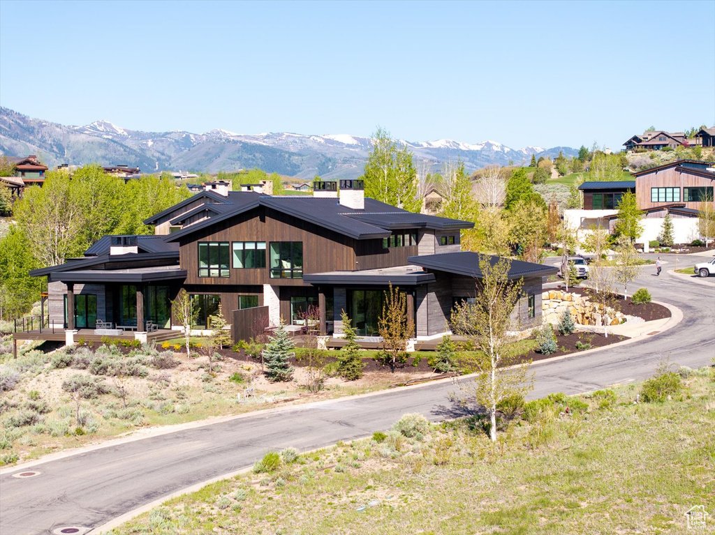 Modern home with a mountain view and a chimney