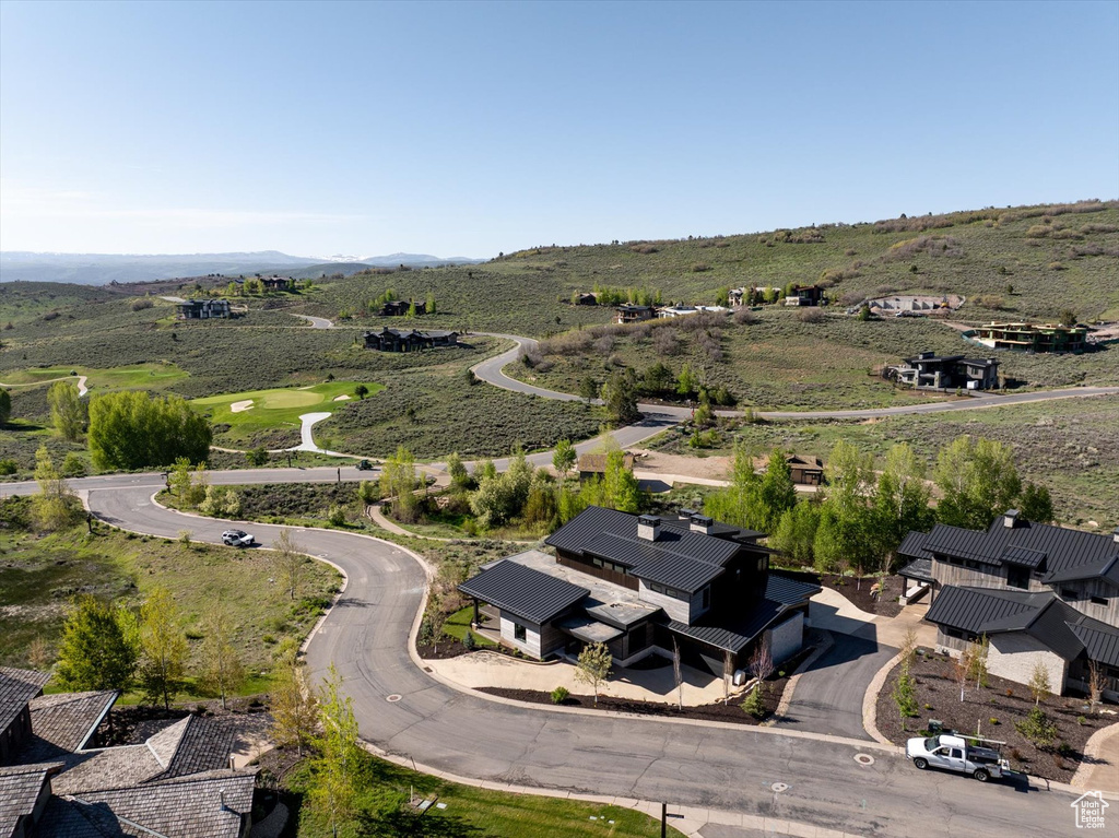 Aerial overview of property's location with a mountainous background