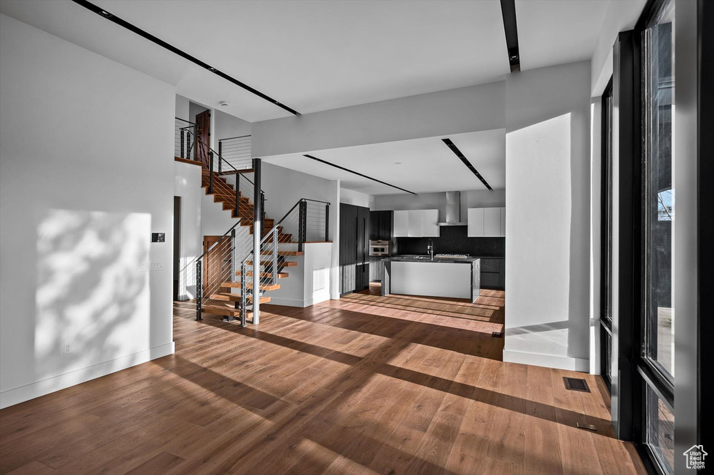 Unfurnished living room with wood-type flooring