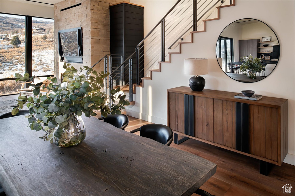 Dining room with dark hardwood / wood-style flooring