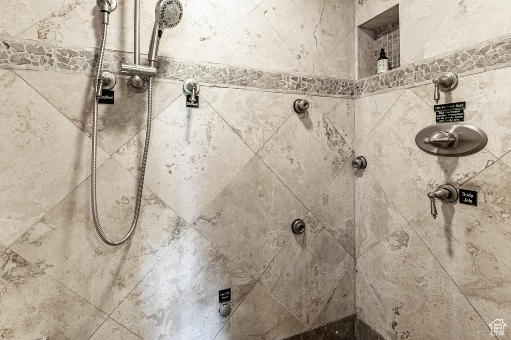 Bathroom featuring tiled shower