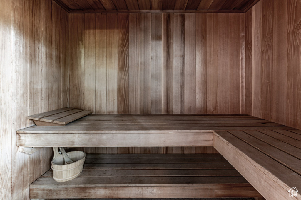 View of sauna / steam room with wooden walls