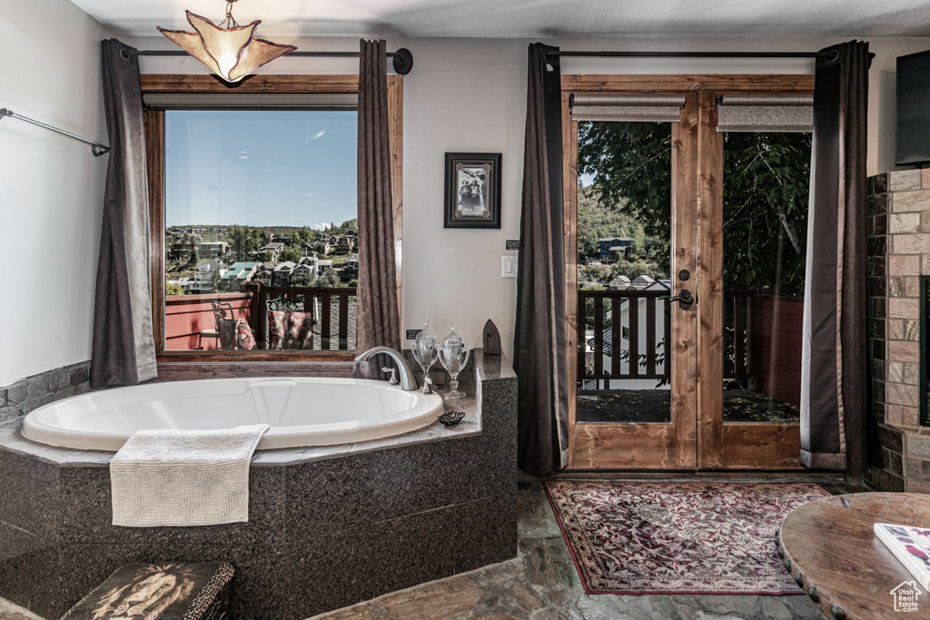 Bathroom featuring tiled tub