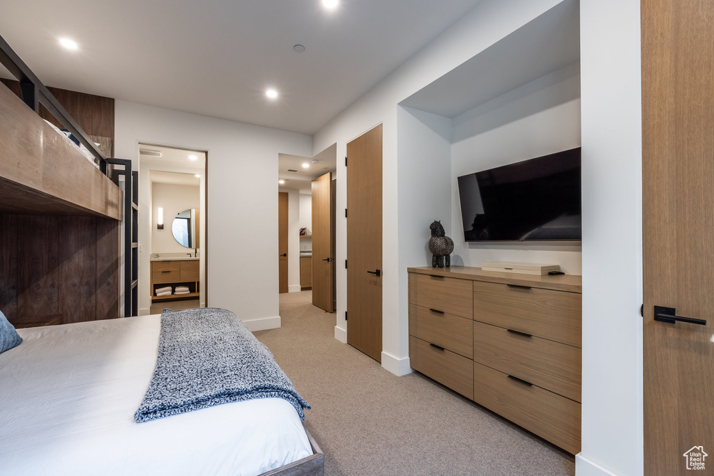 Carpeted bedroom with ensuite bath