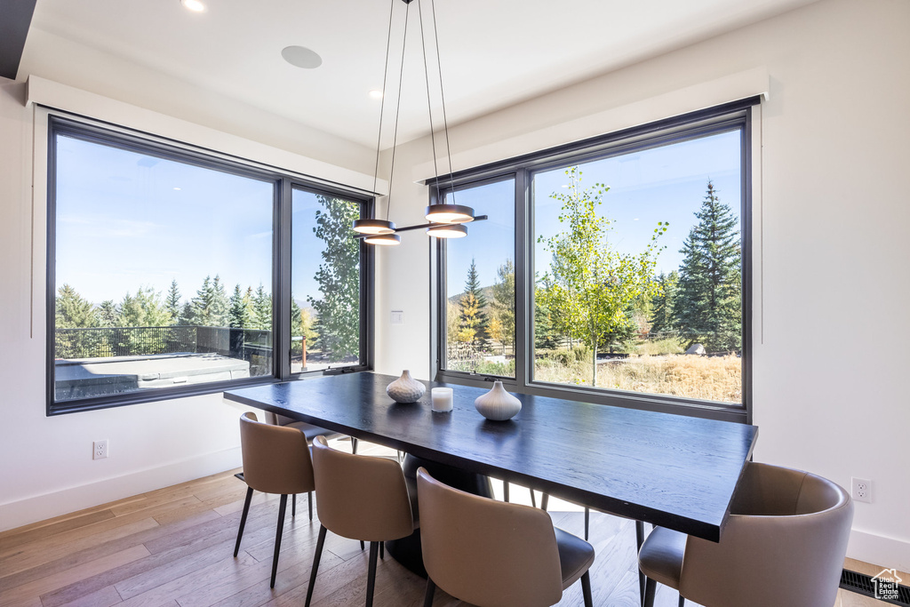 Dining area with light hardwood / wood-style floors