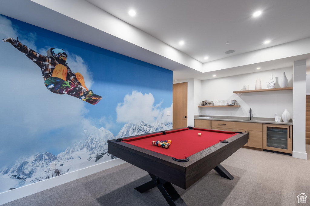Rec room with wine cooler, pool table, light colored carpet, and wet bar