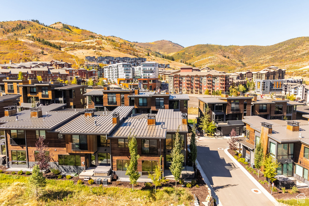 Birds eye view of property with a mountain view