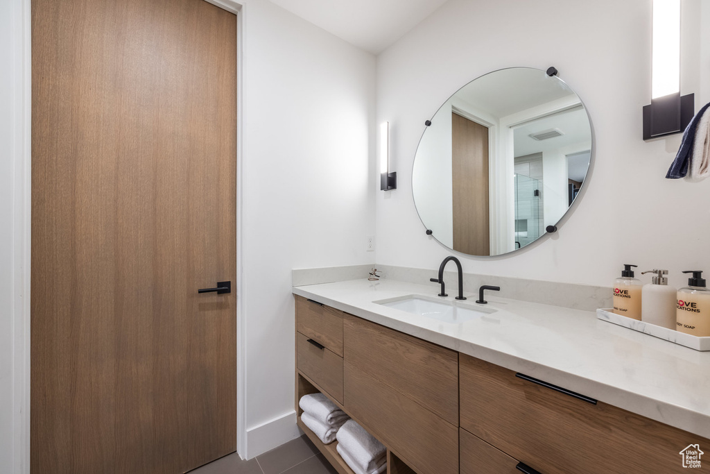 Bathroom featuring vanity and tile patterned floors