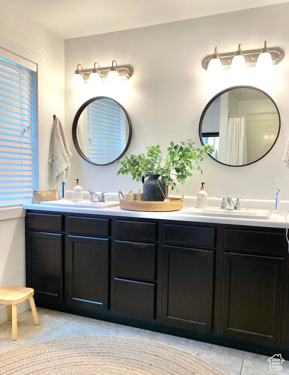 Bathroom featuring vanity and tile patterned floors