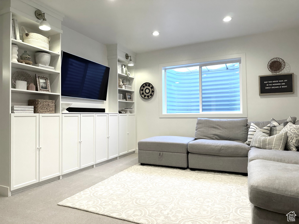 Living room featuring light carpet