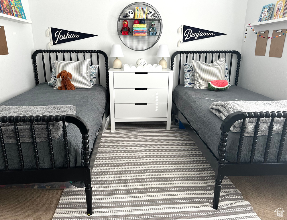 Bedroom with light colored carpet