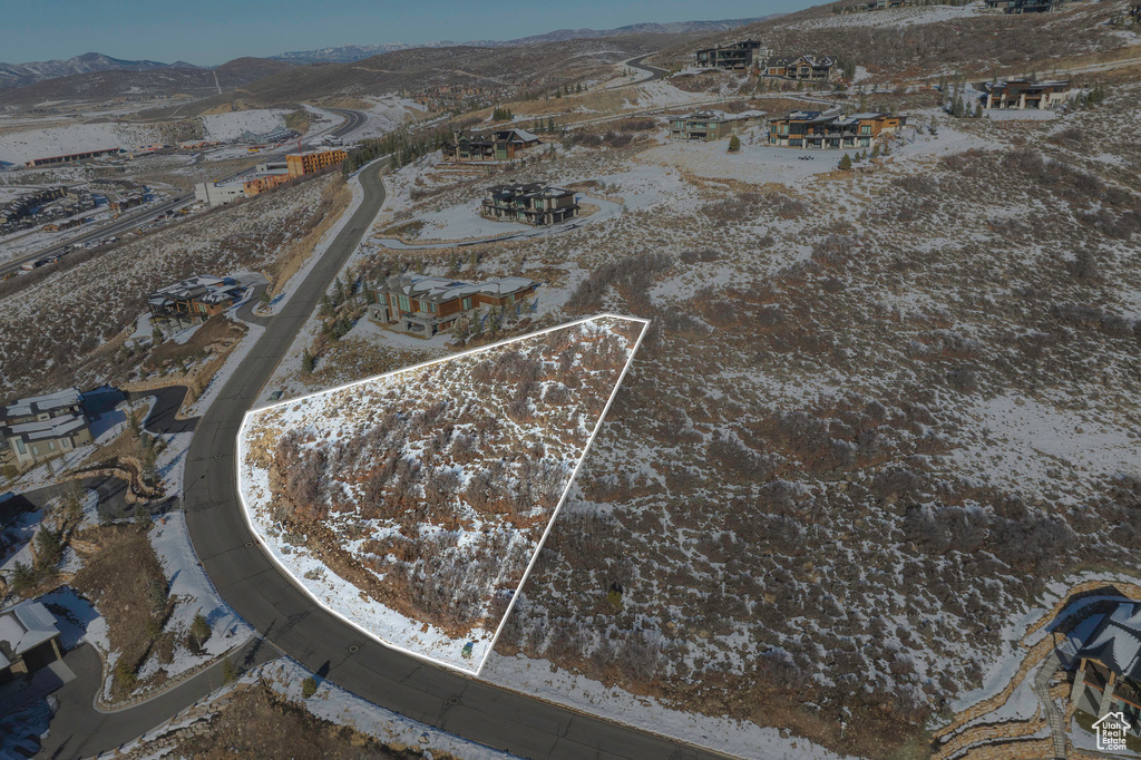 Snowy aerial view with a mountain view