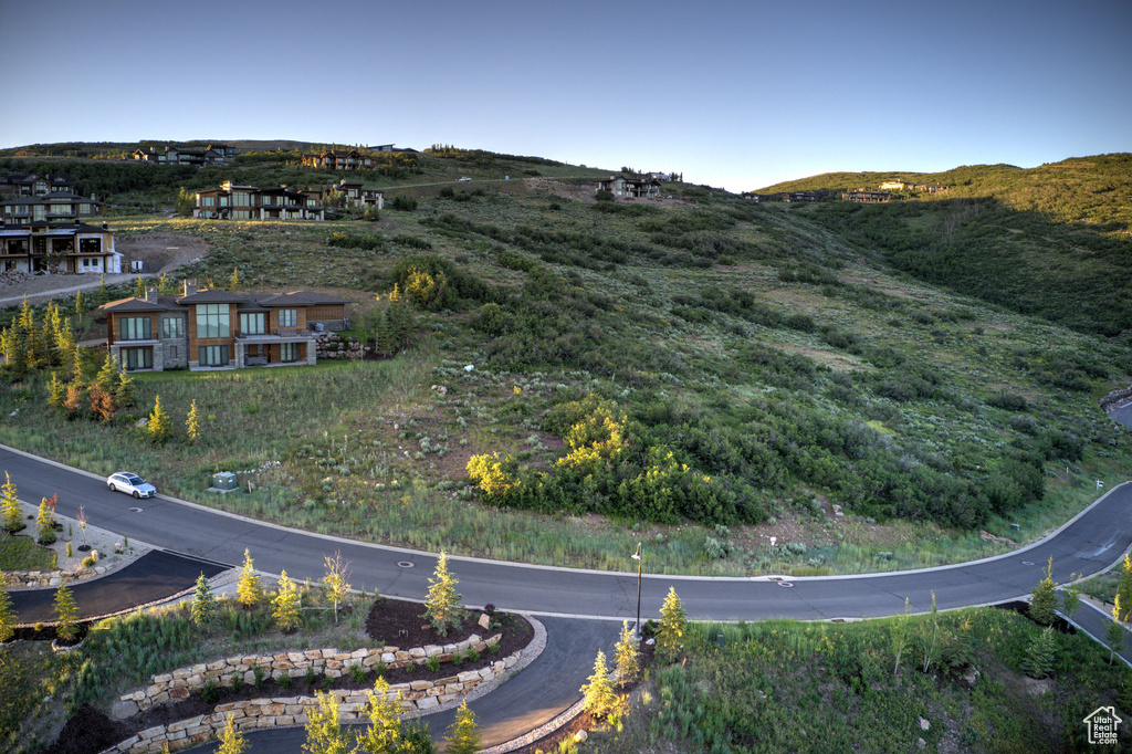 Aerial overview of property's location with a mountainous background