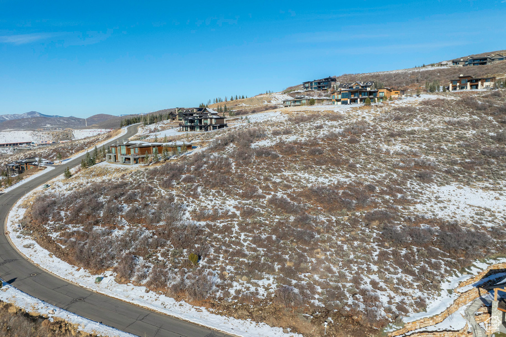Snowy aerial view with a mountain view