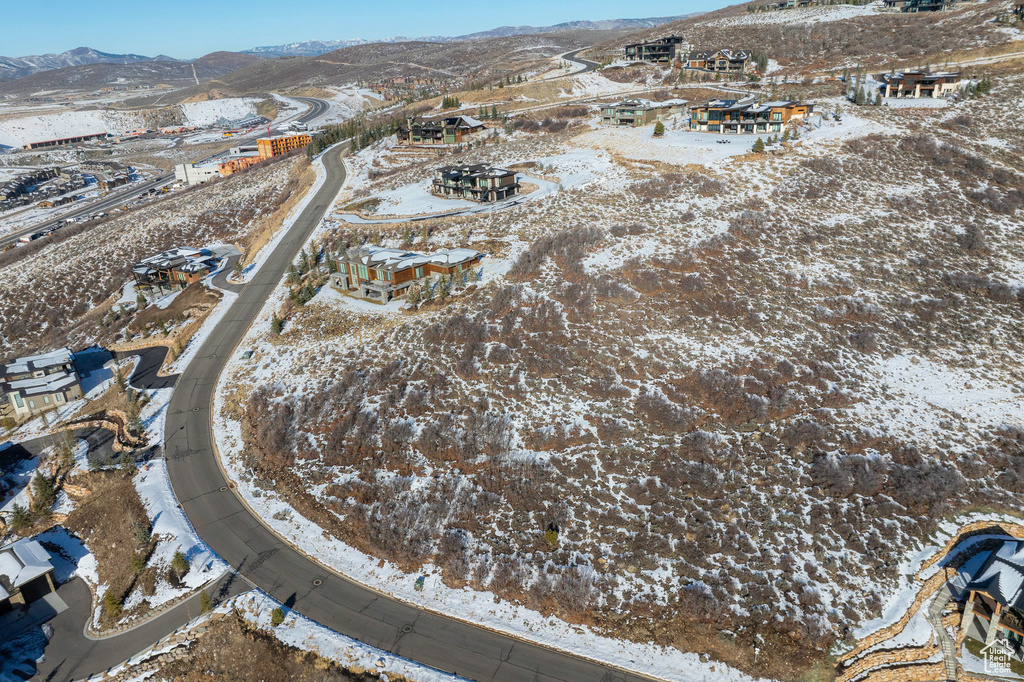 Snowy aerial view featuring a mountain view