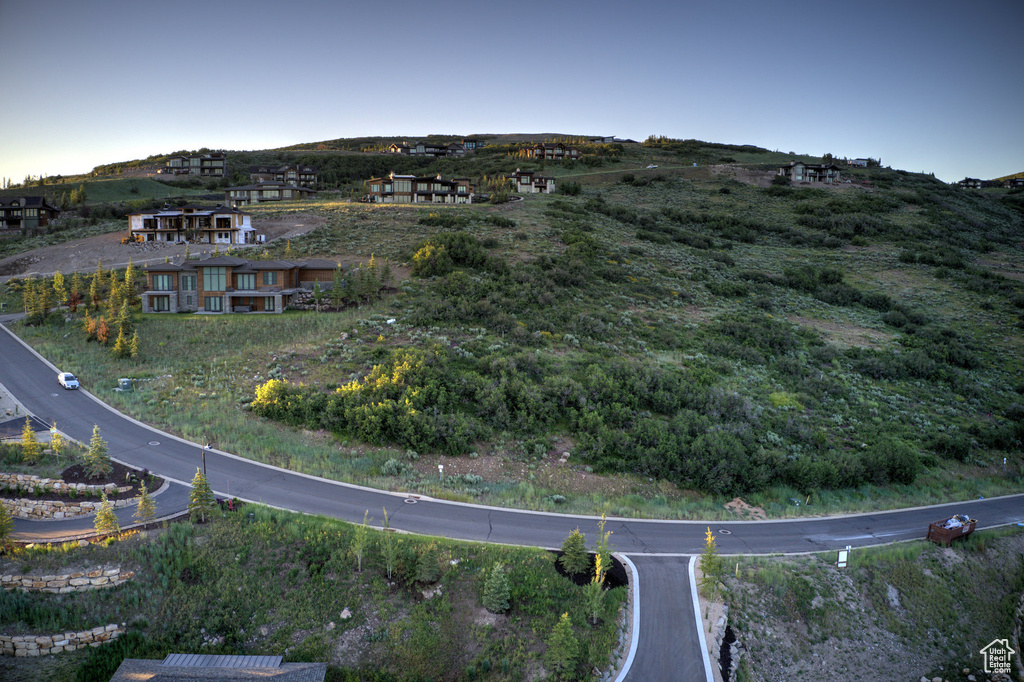 Aerial view of property's location with a mountainous background