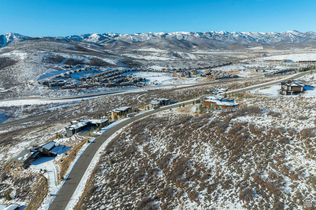 Snowy aerial view featuring a mountain view