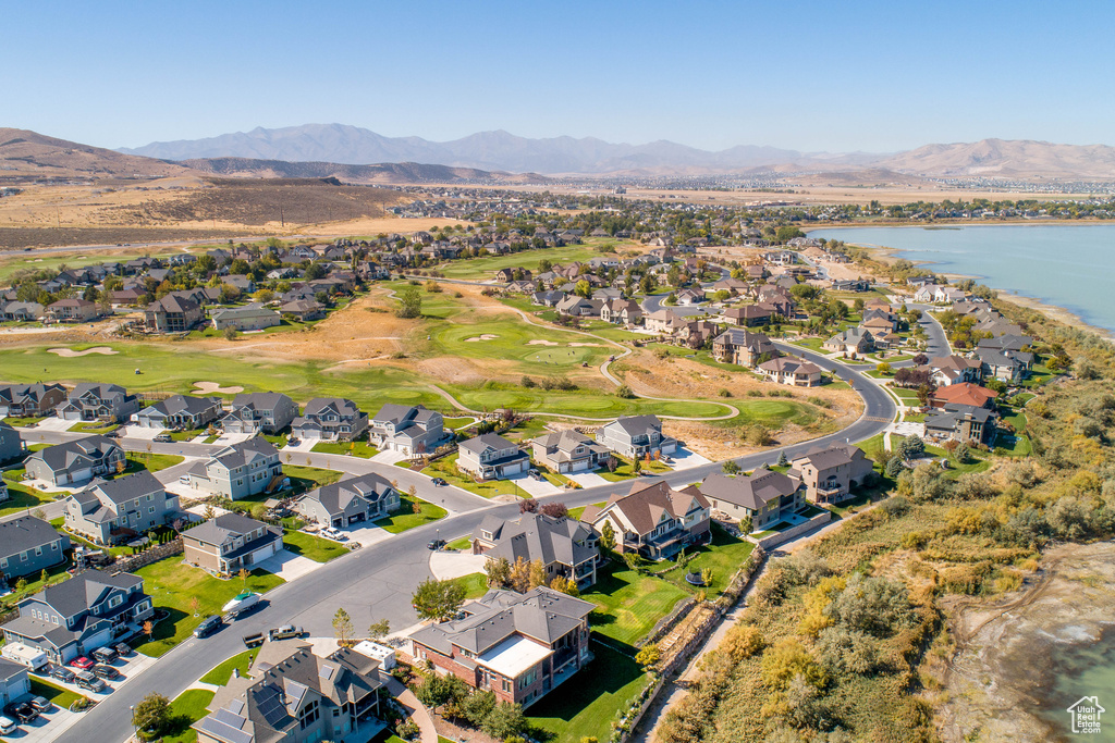 Drone / aerial view with a water and mountain view