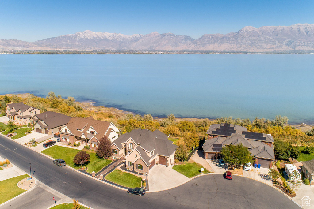 Drone / aerial view with a water and mountain view