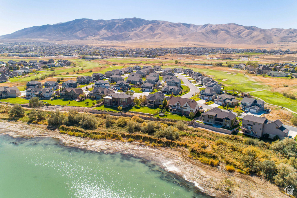 Birds eye view of property featuring a water and mountain view