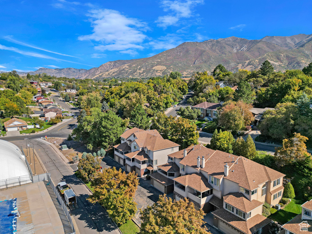 Birds eye view of property with a mountain view