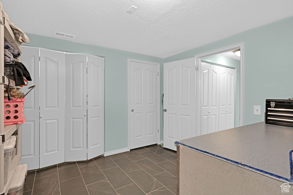 Kitchen featuring a textured ceiling