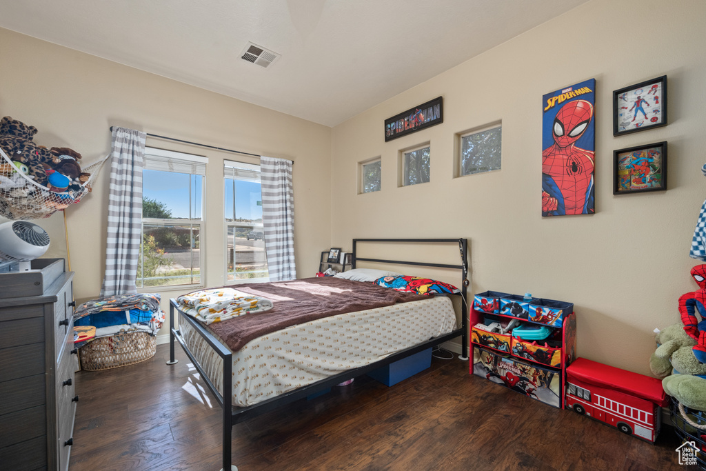 Bedroom featuring dark hardwood / wood-style floors