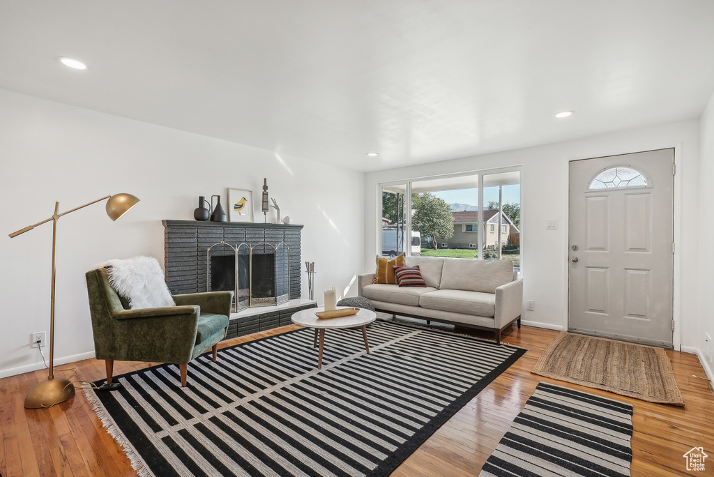 Living room featuring a fireplace and light hardwood / wood-style floors