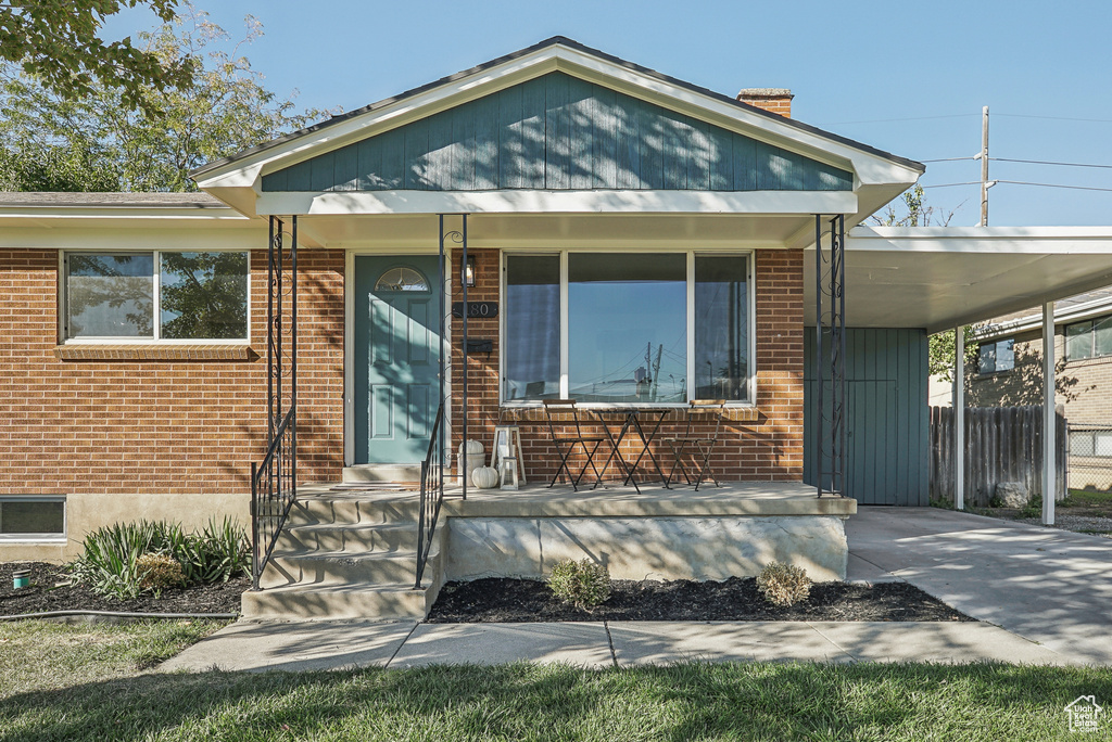 View of front of house featuring a carport