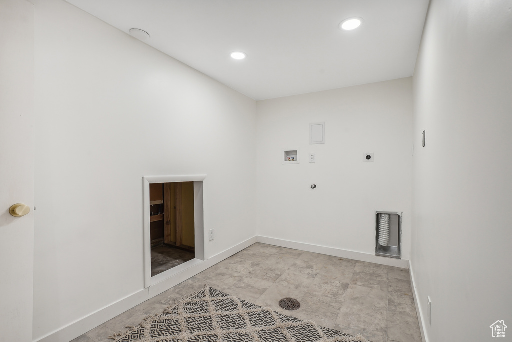 Clothes washing area with hookup for a washing machine, hookup for a gas dryer, and hookup for an electric dryer