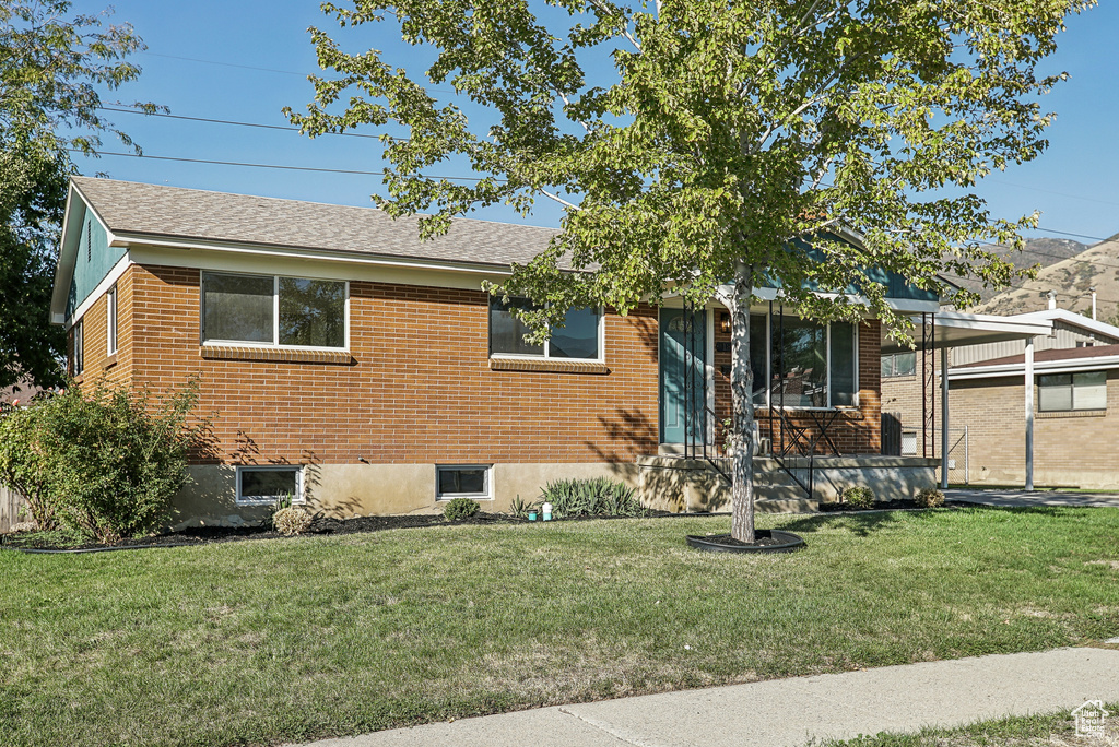 View of front of house with a front lawn