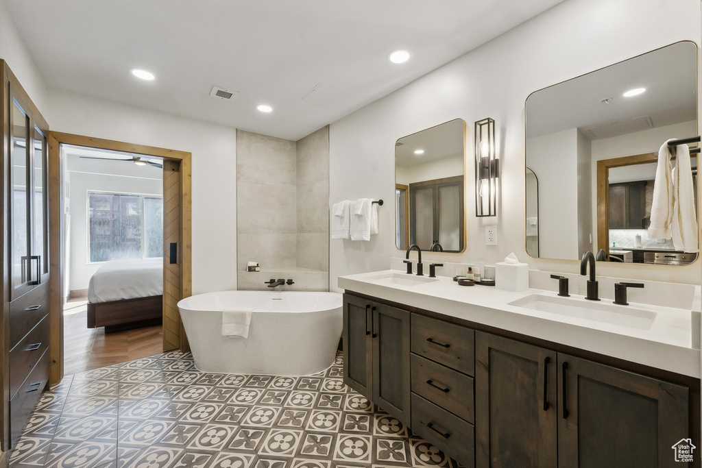 Bathroom featuring vanity and a bathtub