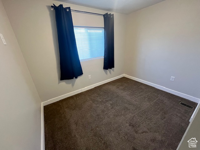 Empty room with carpet floors