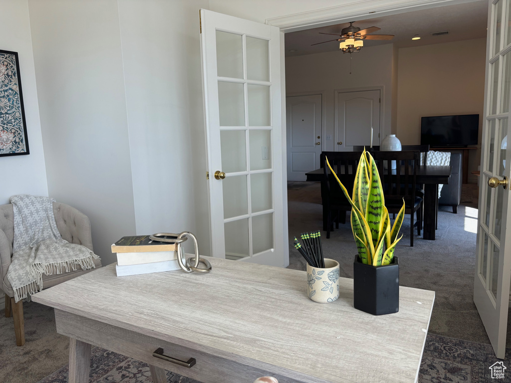 Interior space featuring ceiling fan and french doors