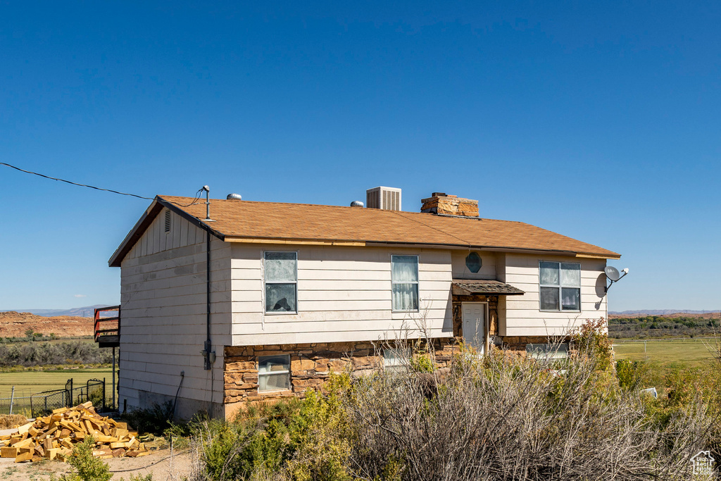 View of front of house with central AC